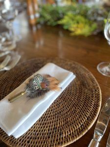 Pheasants feathers decorating dinning table in Poronui lodge